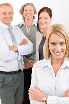 Business team attractive young businesswoman with happy mature colleagues