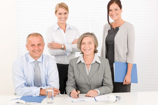Business team attractive businesswomen with happy colleagues working on table
