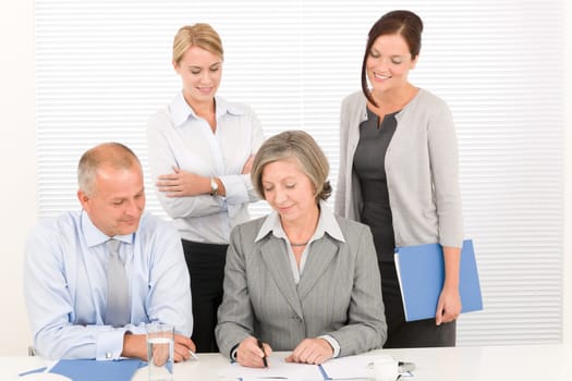 Business team attractive businesswomen with happy colleagues working around table