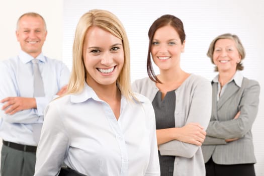 Business team attractive young businesswoman with happy mature colleagues
