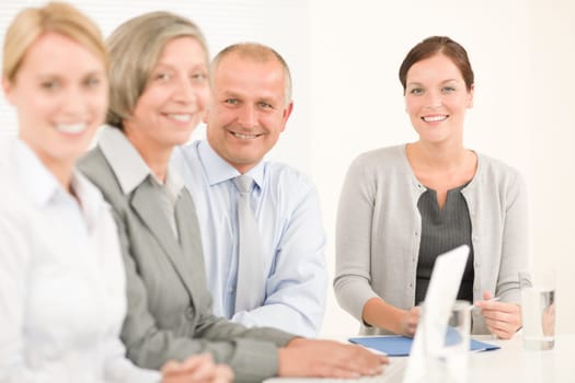 Business team attractive businesswomen with happy colleagues working around table