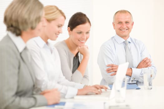 Business team attractive businesswomen with happy colleagues working around table