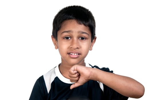 an handsome young indian kid showing thumbs down