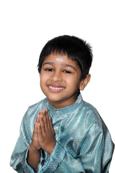 An hanbdsome young Indian child smiling for you