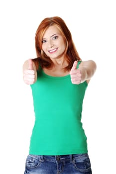 Teen beauty caucasian girl showing her thumbs up. Isolated on white.