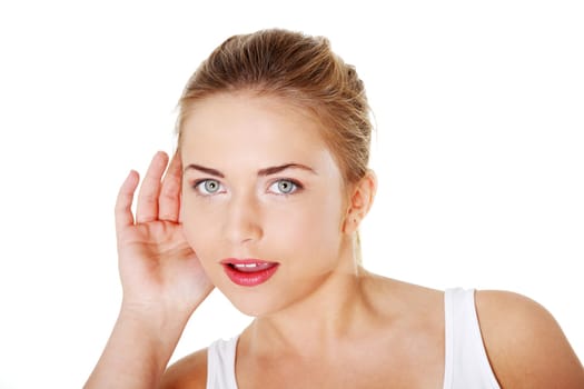 Teen blond woman trying to listening a gossip
