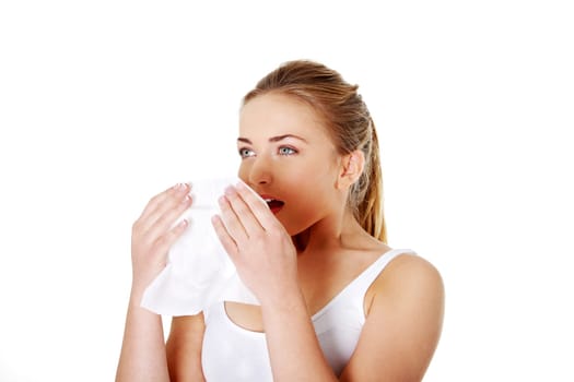 Teen woman with tissue - sneezing