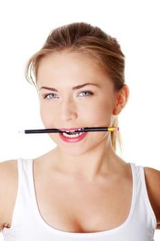 Teen student girl with a pancil in mouth