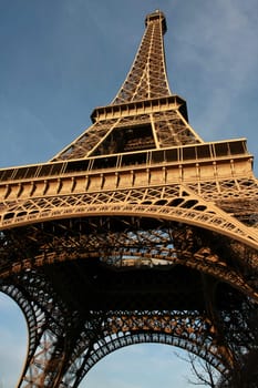 Wide-angle view of the Eiffel Tower by sunset