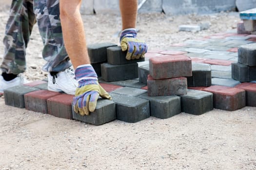 brick paver working on new street