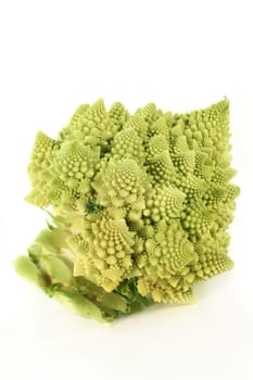 a fresh,raw Romanesco against a white background