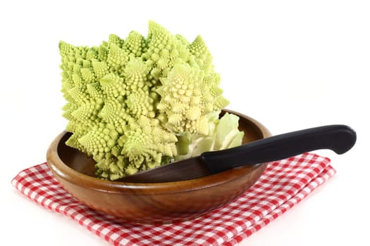 a fresh,raw Romanesco against a white background