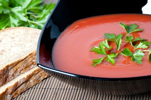 closeup of a tomato soup with parsley