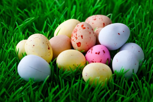 Close-up of pastel colored Easter eggs on grass