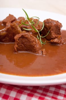 Closeup of Traditional Venison Goulash on White Plate