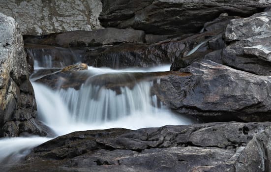 A small waterfall in a stream flowing down rocks