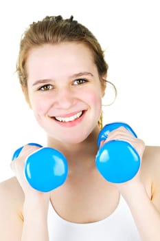 Portrait of smiling fit young woman working out with weights for fitness exercise