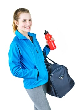Smiling fit young woman with gym bag and water bottle ready for fitness exercise