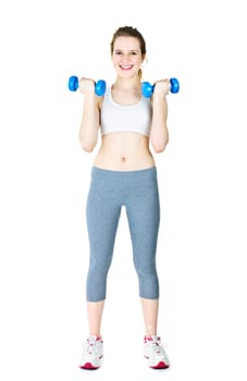 Happy fit young woman working out with weights standing on white background