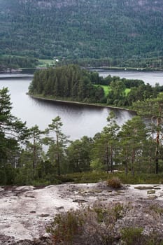 Seljord lake, Norway  surrounded by mountains and woods  village on the far side of the lake.