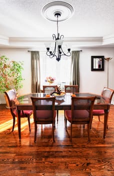 Dining room interior with wooden table and chairs in house