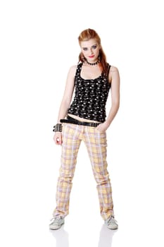 Standing punk girl holding one hand in her pocket. Isolated on white.