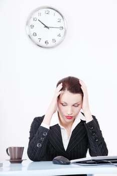 Pretty caucasian tired businesswoman sitting in the office.