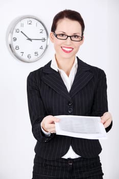 Pretty caucasian standing businesswoman giving files.