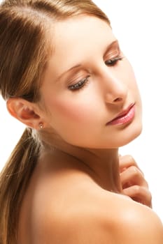 Young beautiful blonde woman looking at her shoulder on white background