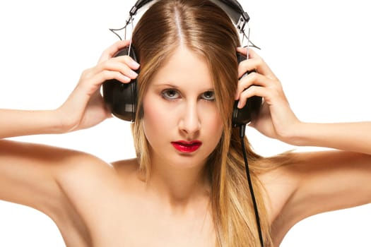Young beautiful woman with headphones on white background
