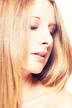 Portrait of a young beautiful woman looking at the side