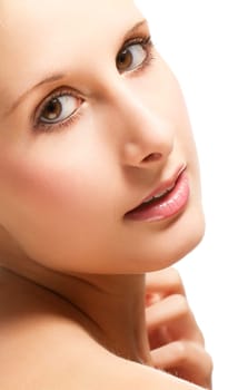 Portrait of a young beautiful blonde woman on a white background