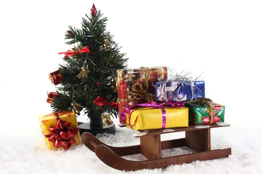a sleigh with colorful gifts in the snow