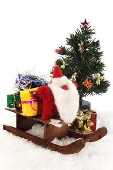 a sleigh with colorful gifts in the snow