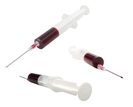 Collection of Medical Syringes With Blood Isolated on White