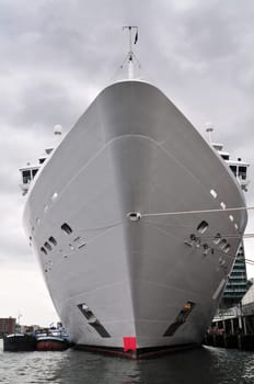 Big cruise ship nose docked at port, Amsterdam.