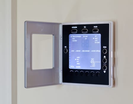 Electronic thermostat with blue LCD screen for controlling air conditioning and heating HVAC