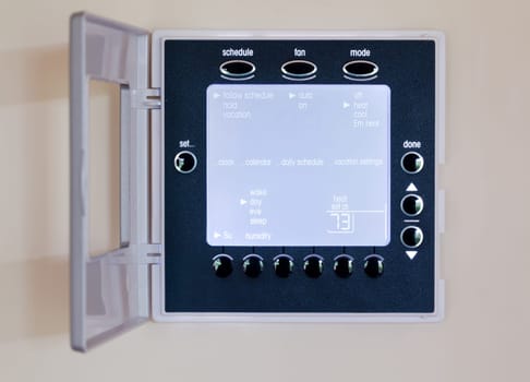 Electronic thermostat with blue LCD screen for controlling air conditioning and heating HVAC