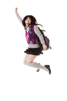 Female Chinese student with a backpack on a white background jumping in the air.
