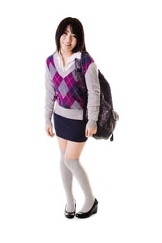 Coy female Chinese student with a backpack on a white background.