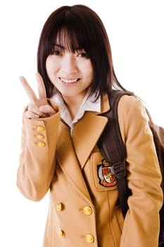 Female Chinese student showing a peace sign.