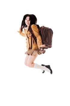 Female Chinese student wearing a backpack on a white background jumping into the air.