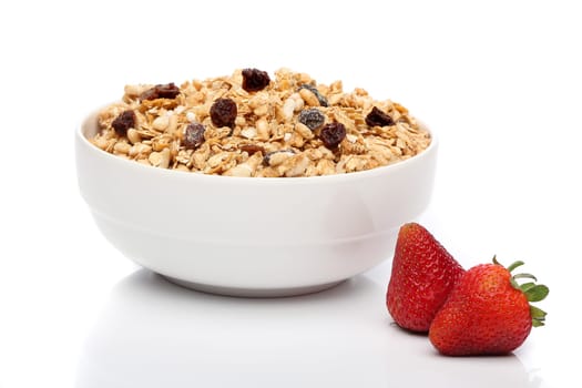 Granola breakfast on a bowl over white background
