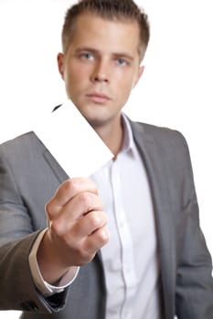 Young businessman showing an empty business card