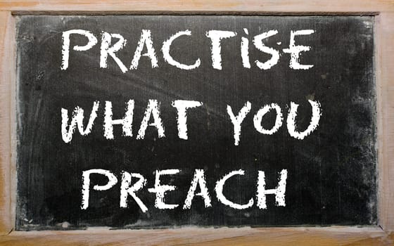 Blackboard writings "Practise what you preach"""
