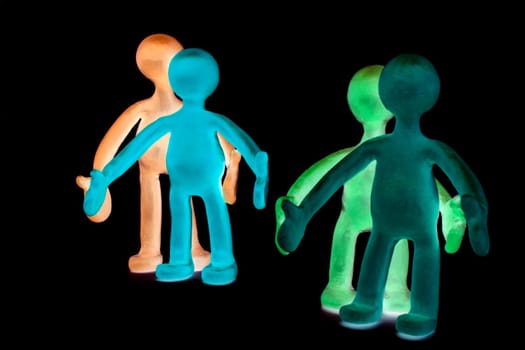 Shaded plasticine puppets pair standing near each other