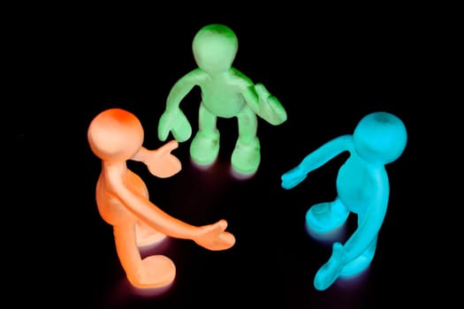 Look above shaded plasticine puppets on black background