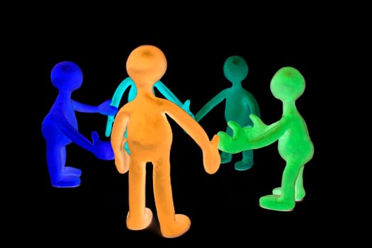Look on shaded discussing plasticine colored puppets group