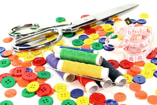 many colorful buttons in front of a white background