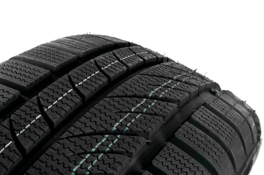 Winter tire close up on white background.